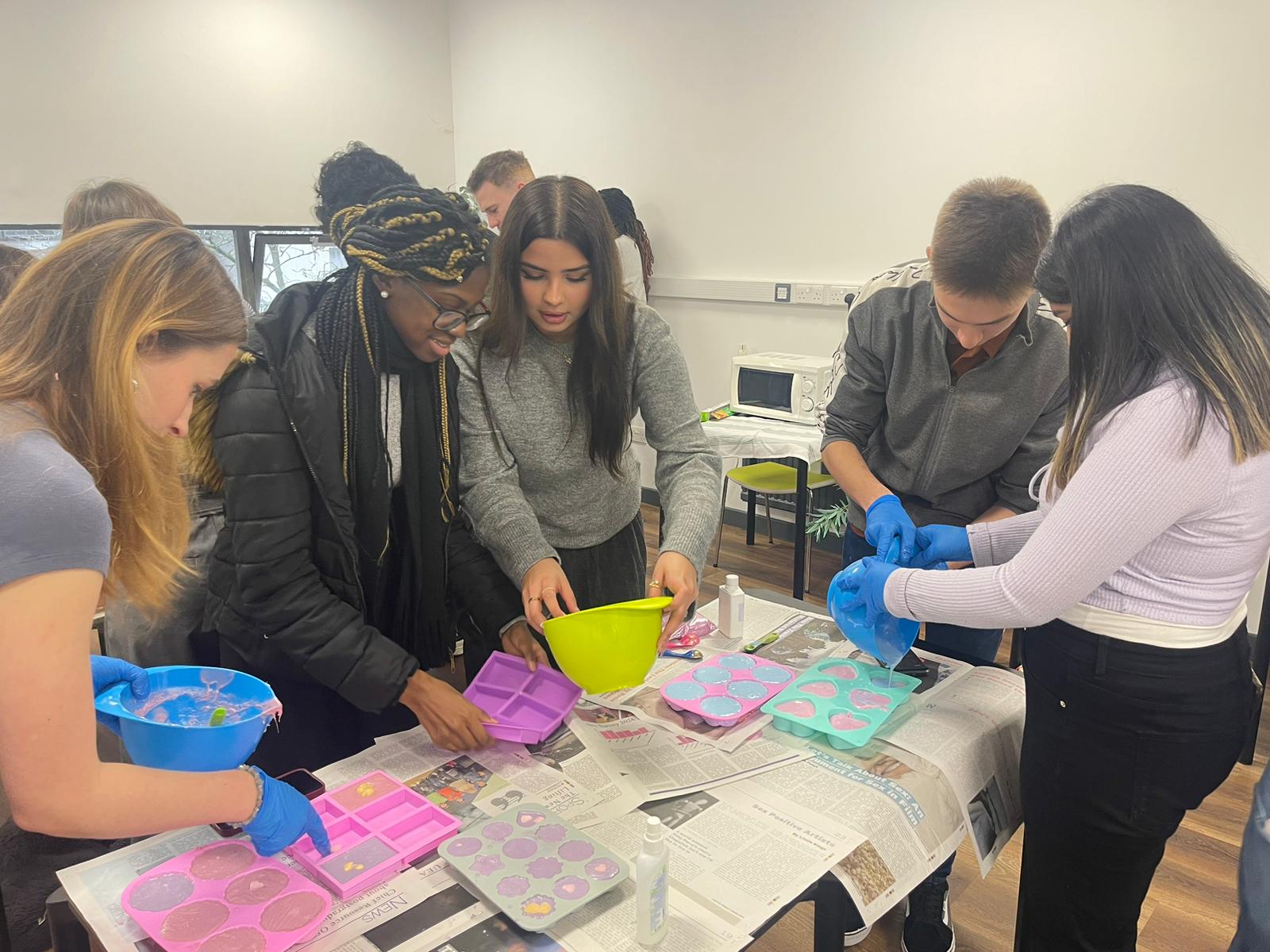 Students making soap at the soap making workshops