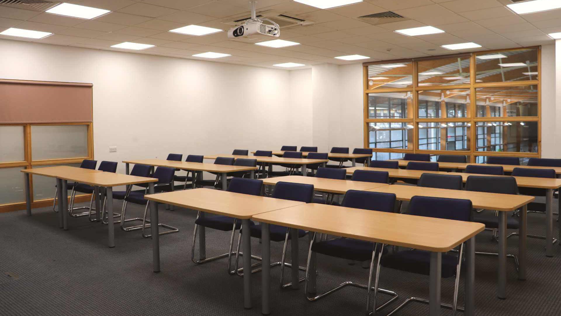 A Sportspark seminar room overlooking a swimming pool