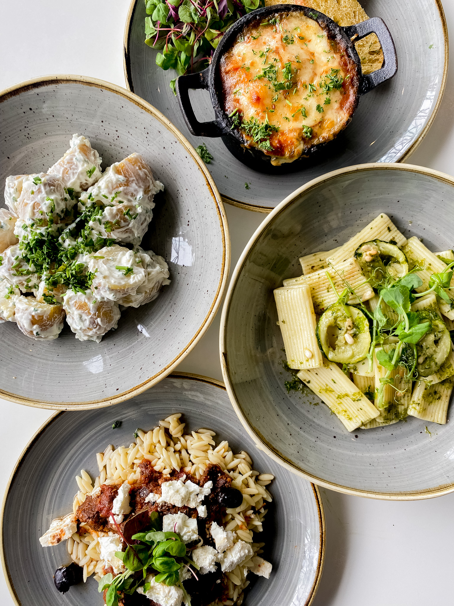 Four plates of food from the Modern Life Cafe.