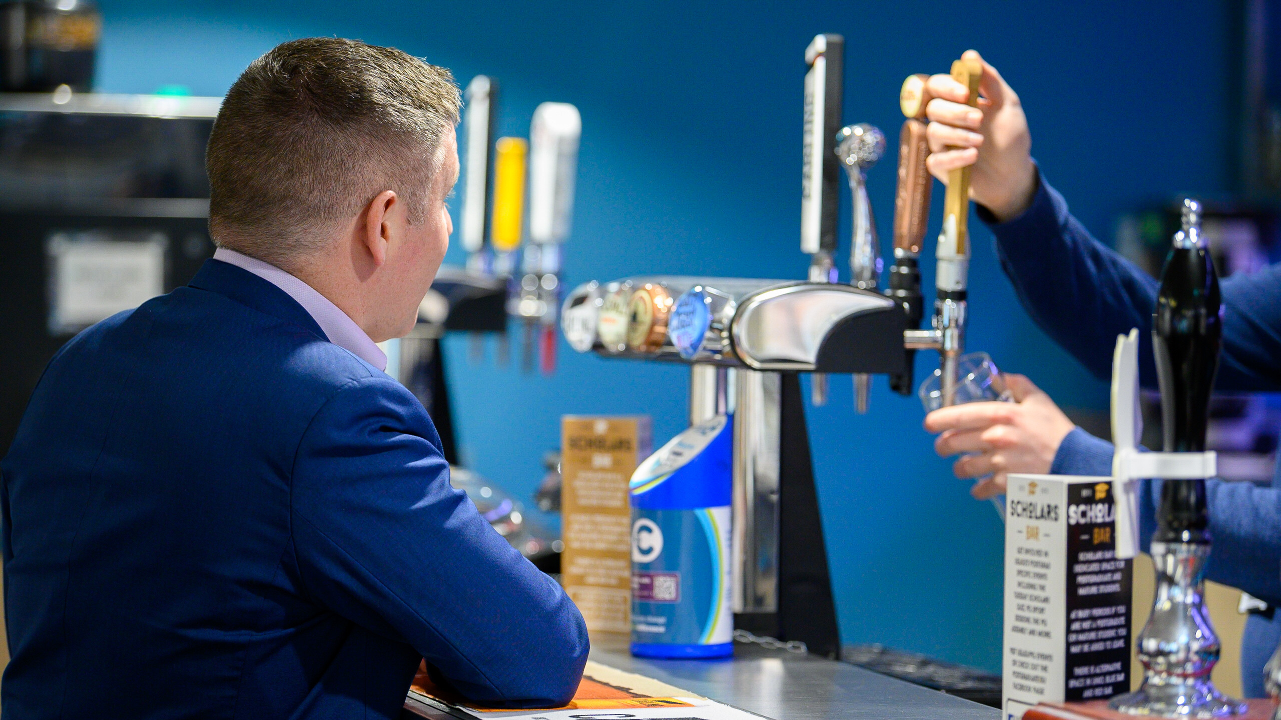 Staff member at Scholars Bar