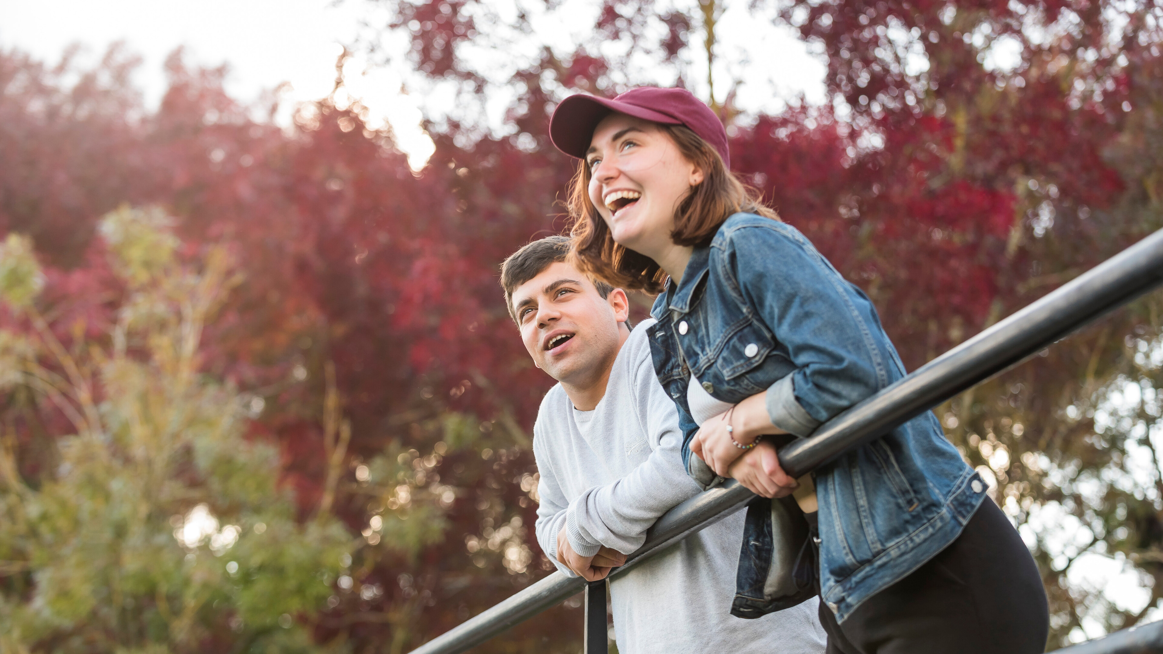 Students leaning over railing