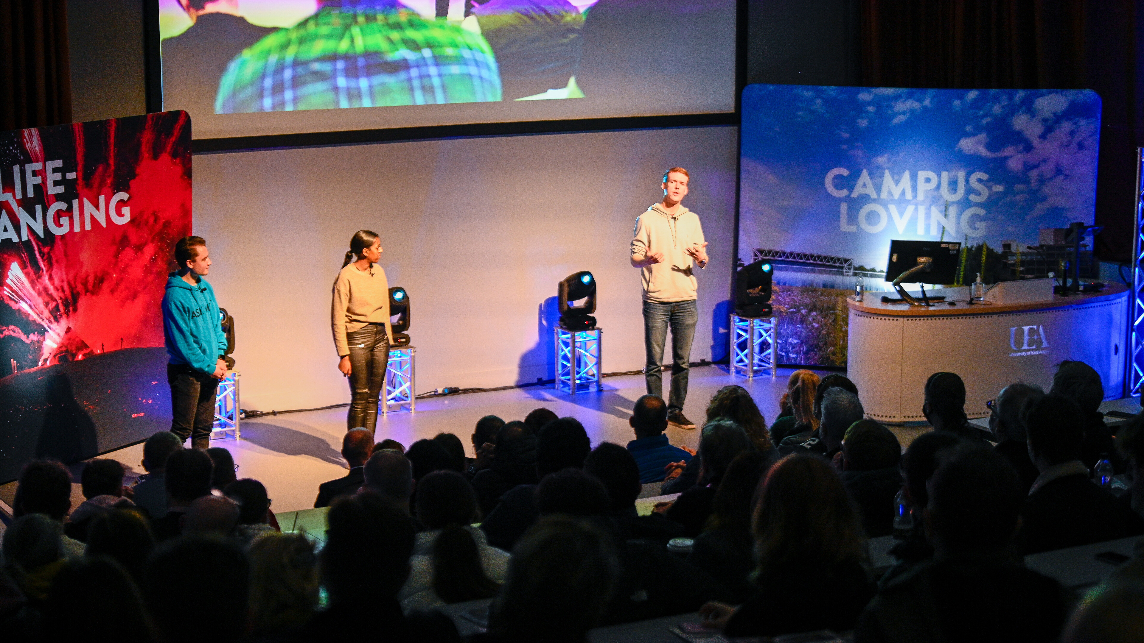 Students presenting on stage in lecture theatre 1