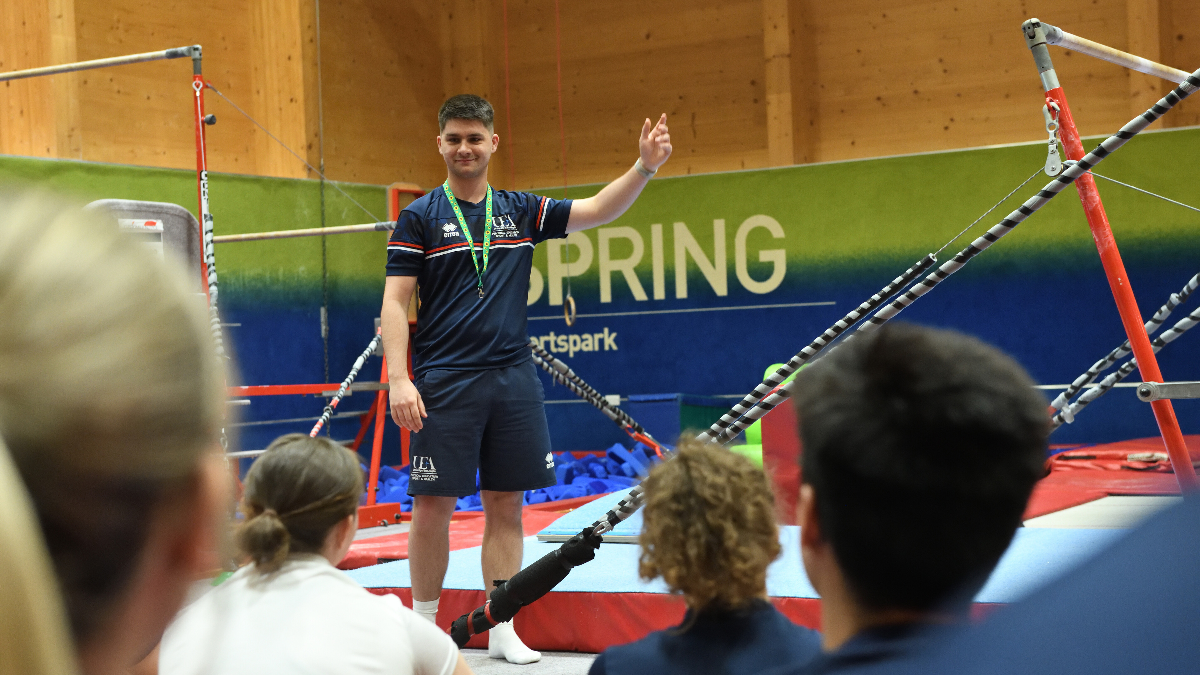 Student demonstrating on gymnastics equipment