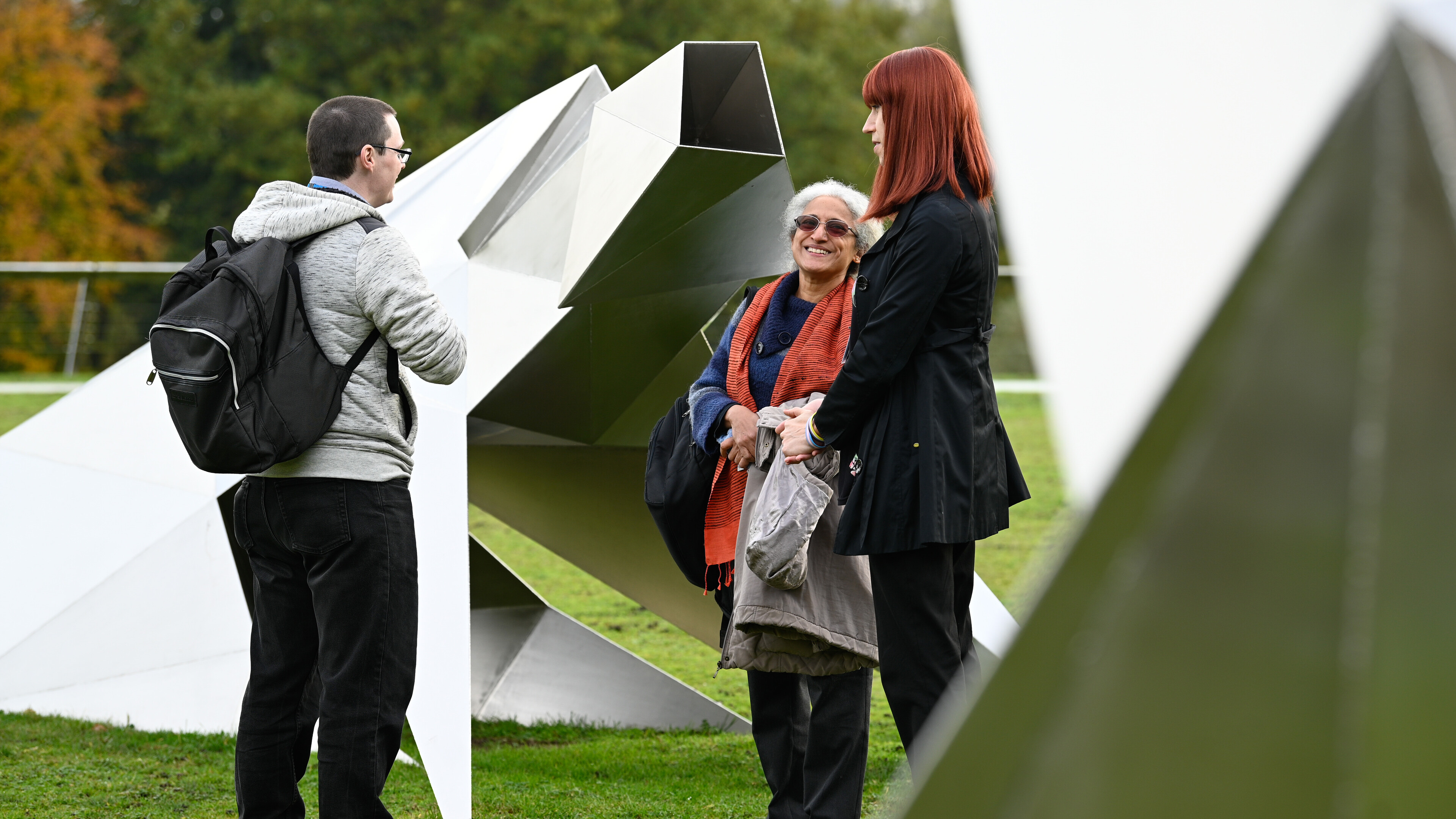 Colleagues with sculpture