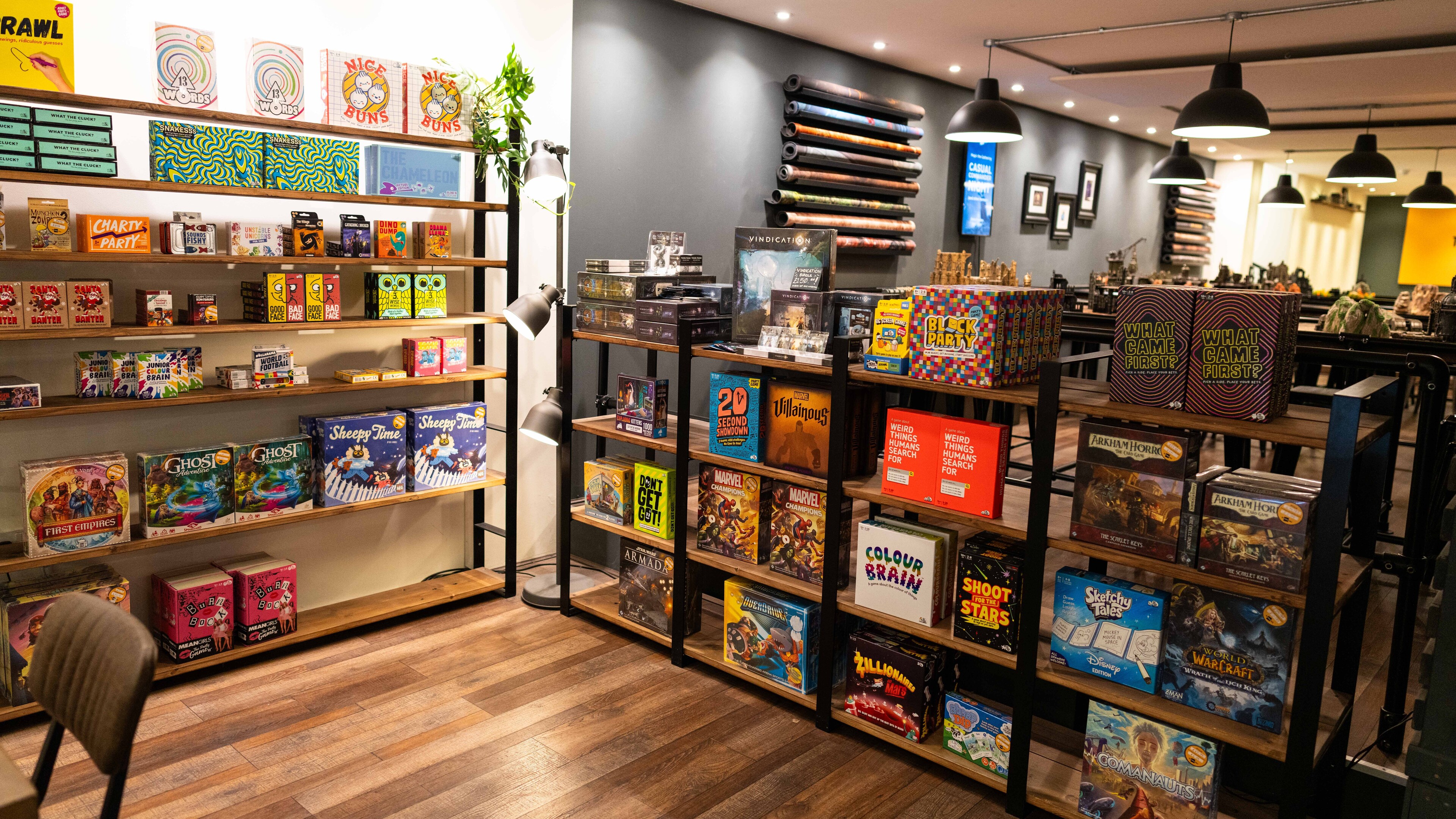 Board games on shelves at the Games Table in Norwich