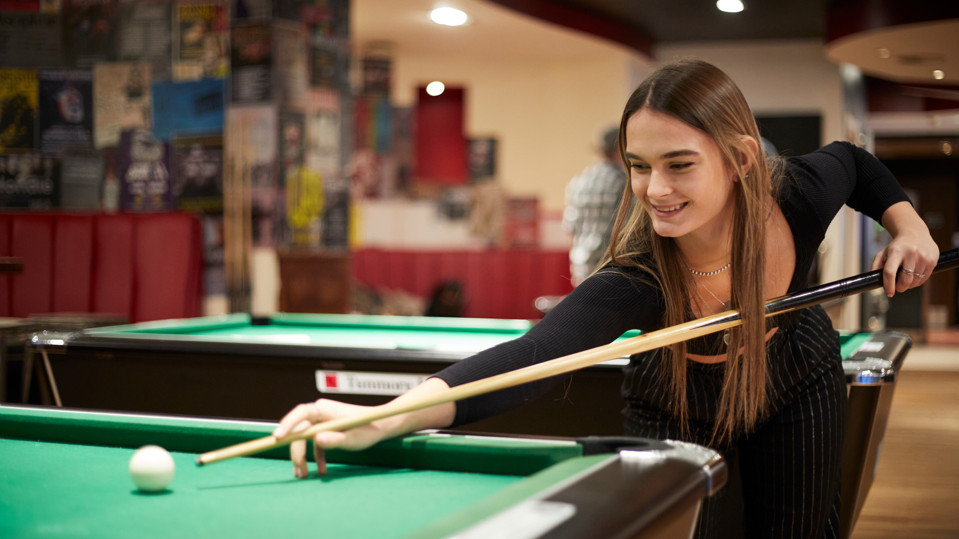 Student playing pool