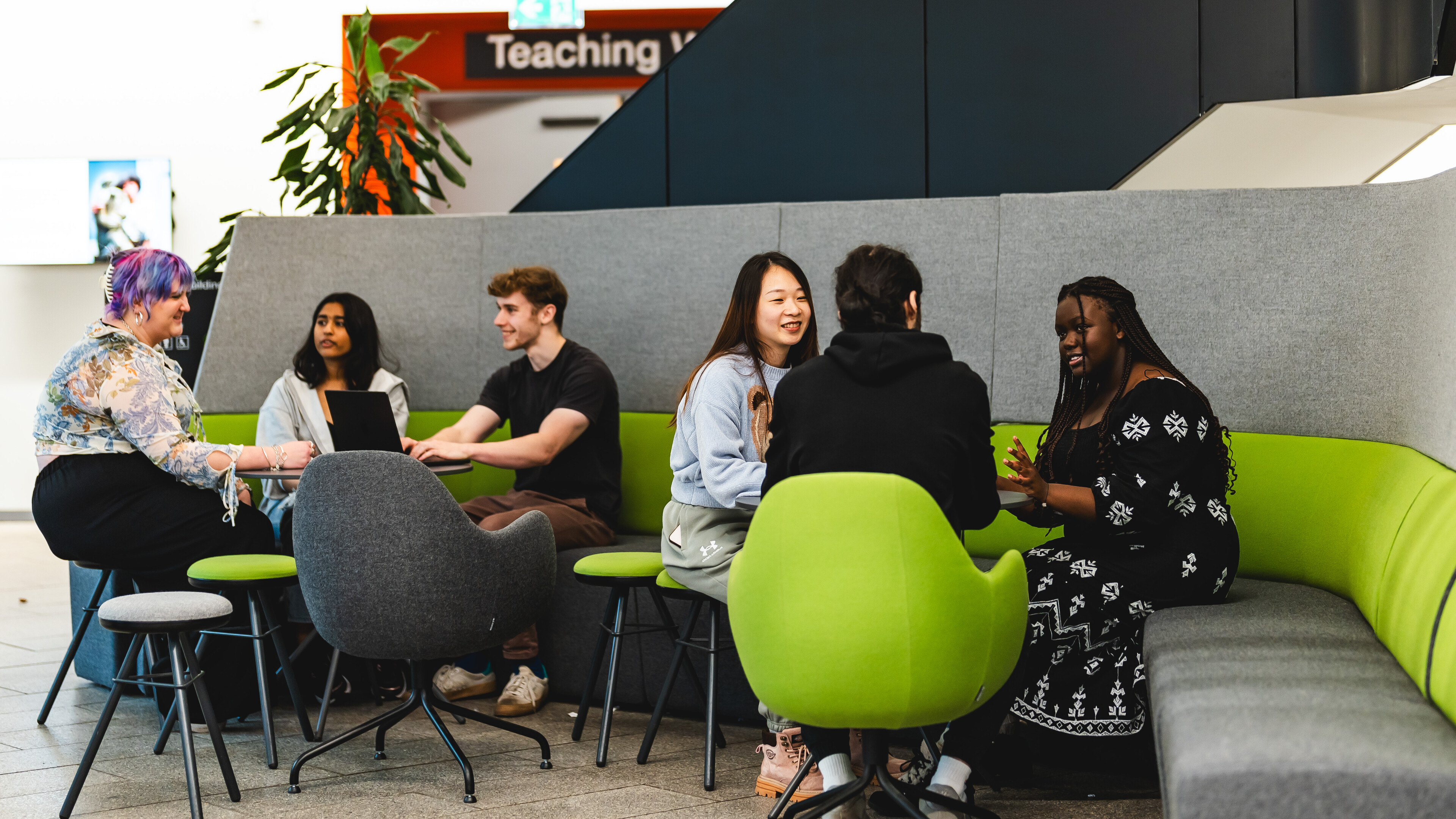 People sitting in the new sci foyer