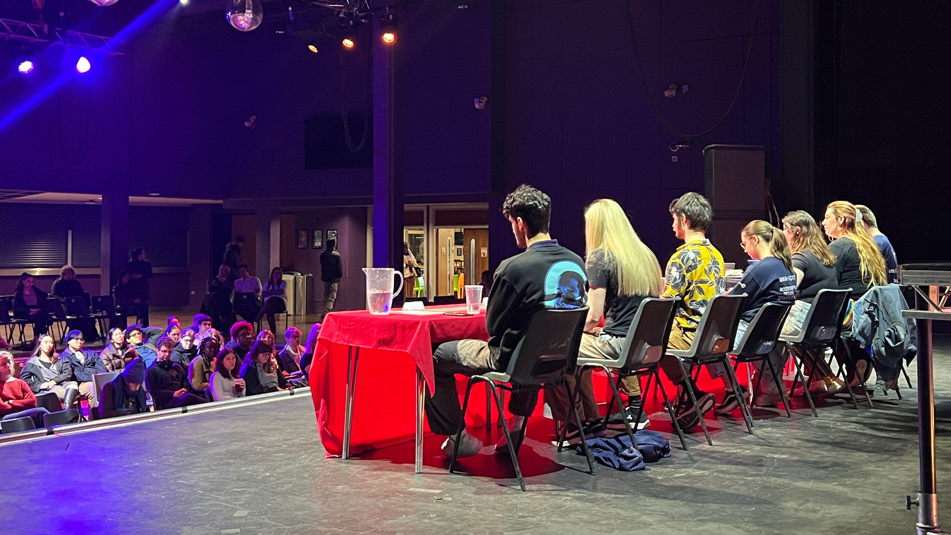 A panel of people on stage at the LCR.