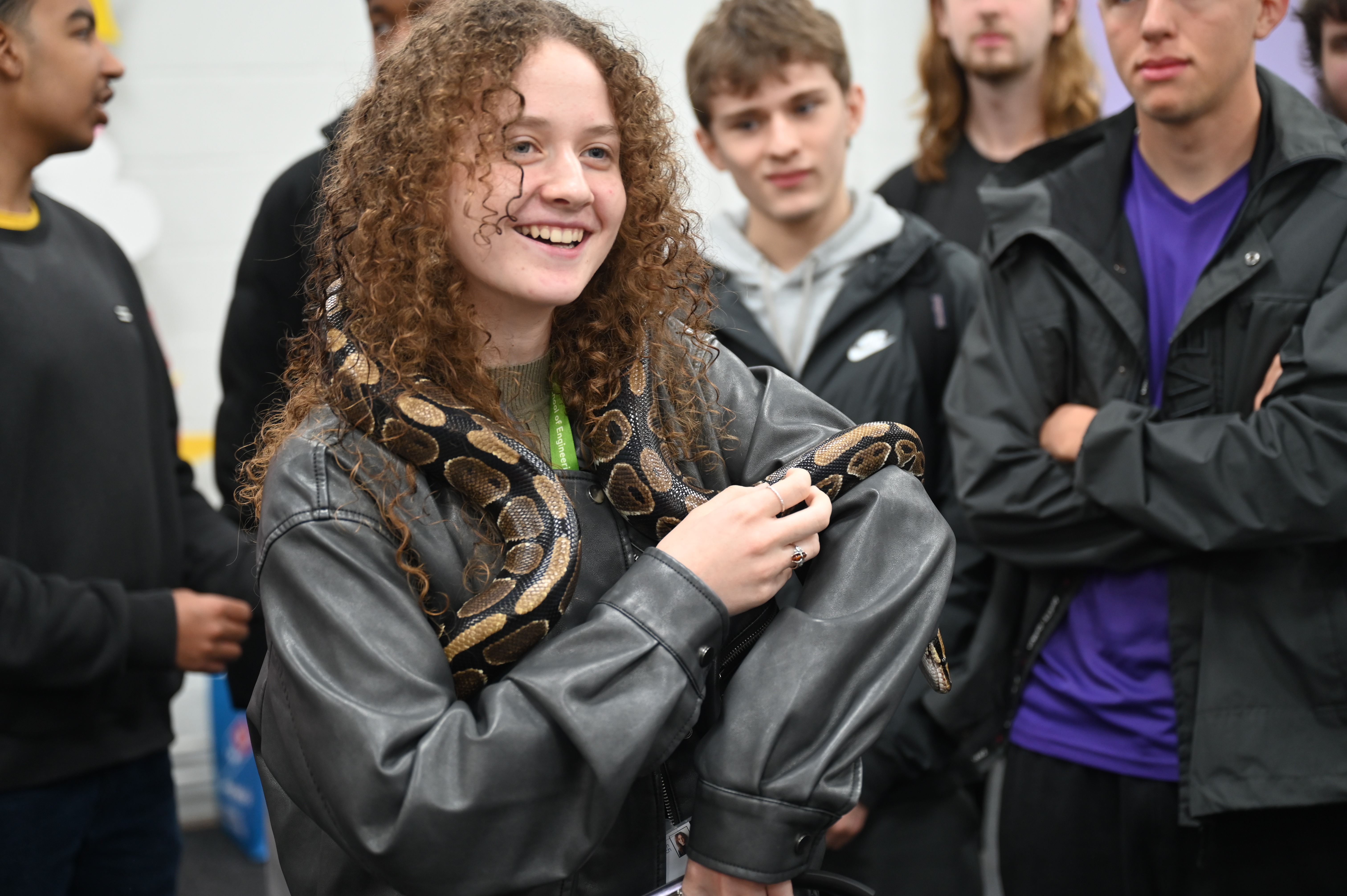 UEA student holding a snake