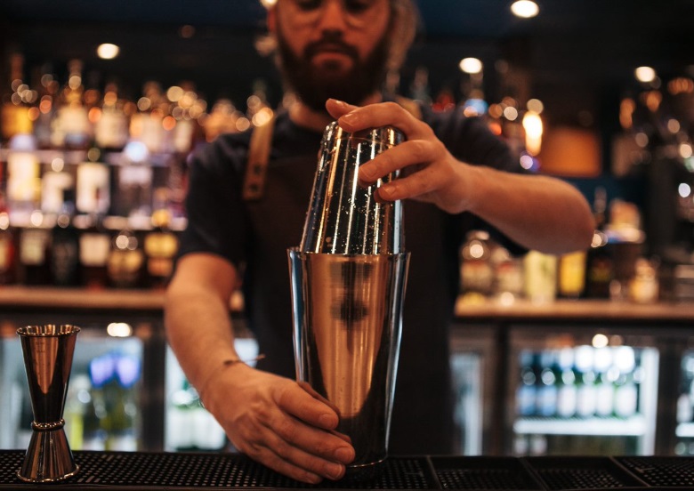 Bartender making a drink at the Bowling House