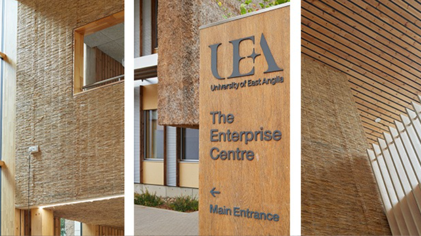 Brown, thatch walls, a UEA Enterprise Centre wooden sign, a modern atrium with hay-like walls.
