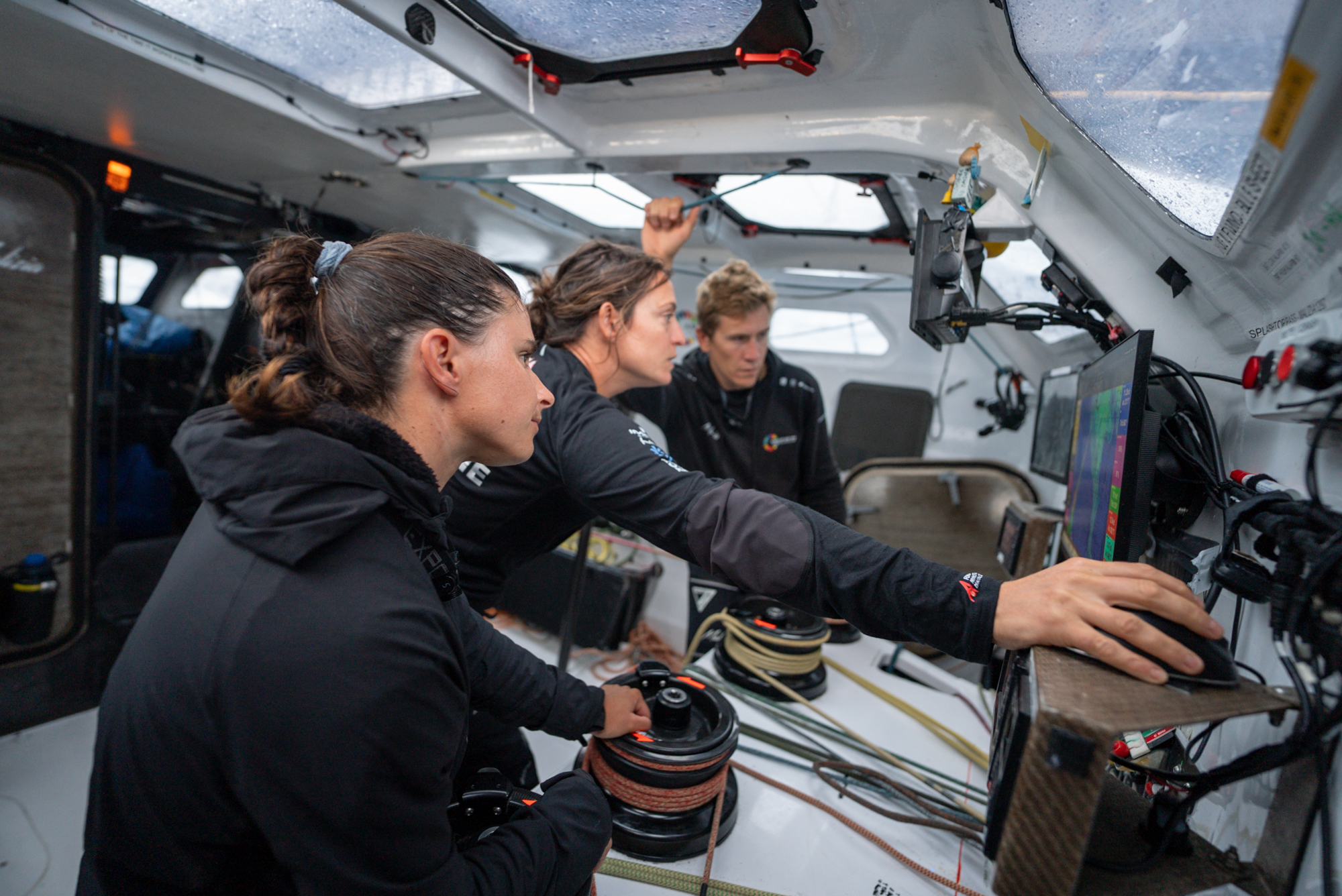 Co-skippers Cole Brauer, Justine Mettraux, and Will Harris fighting until the very end of Leg 1