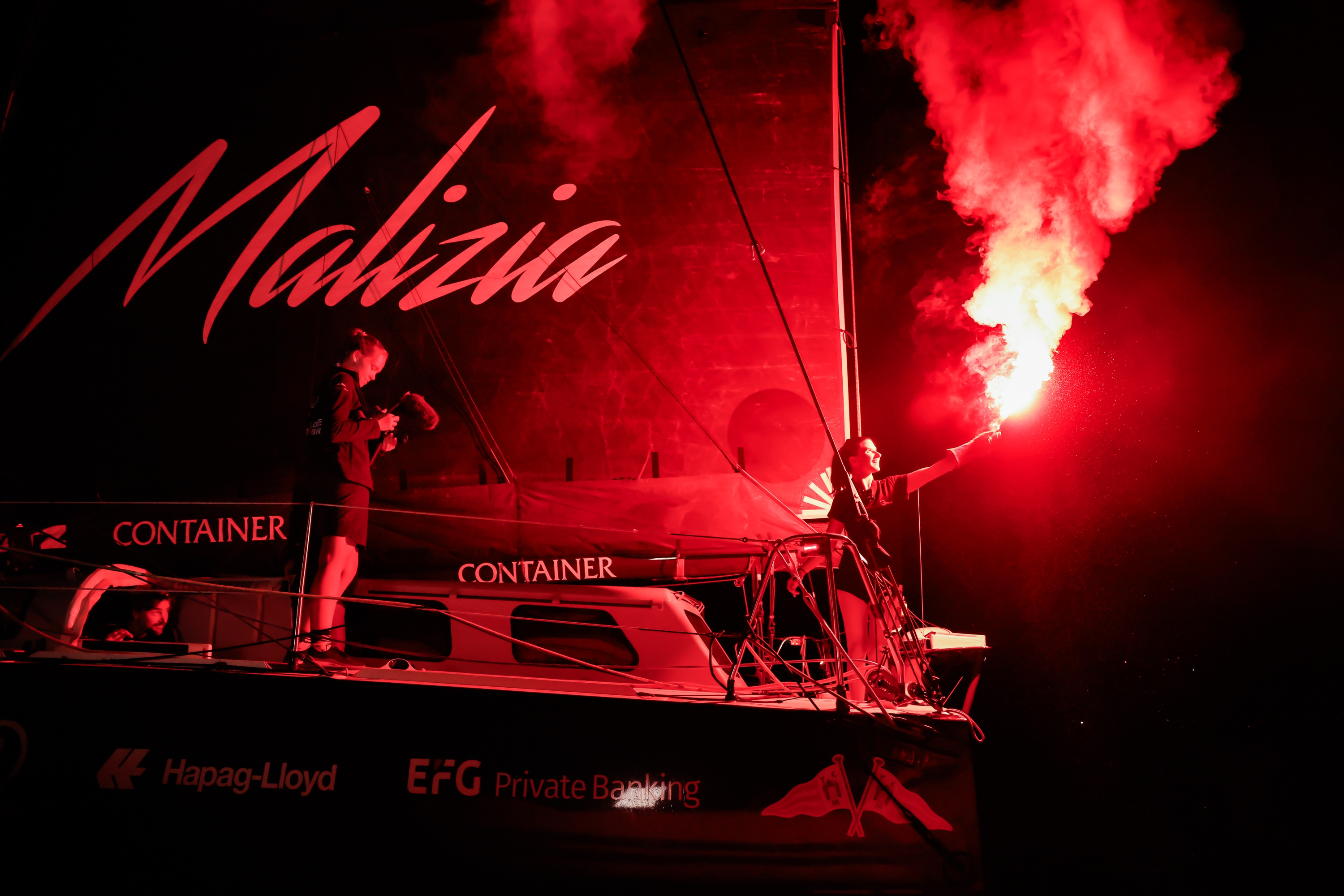 Cole Brauer, filmed by Flore Hartout, celebrating Team Malizia's third-place finish in Leg 5