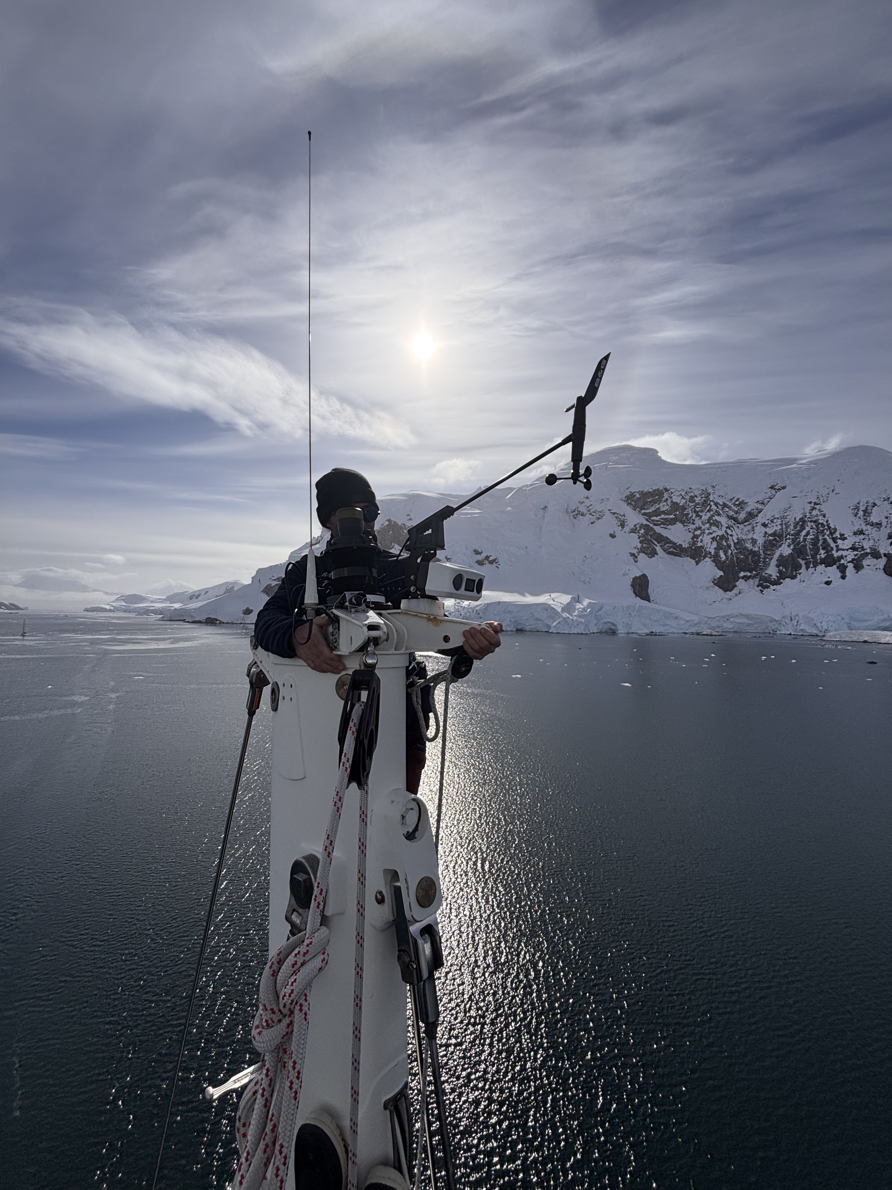 Jonathan Morice on the mast of Malizia Explorer checking the rigging and SEA.AI watchkeeper.