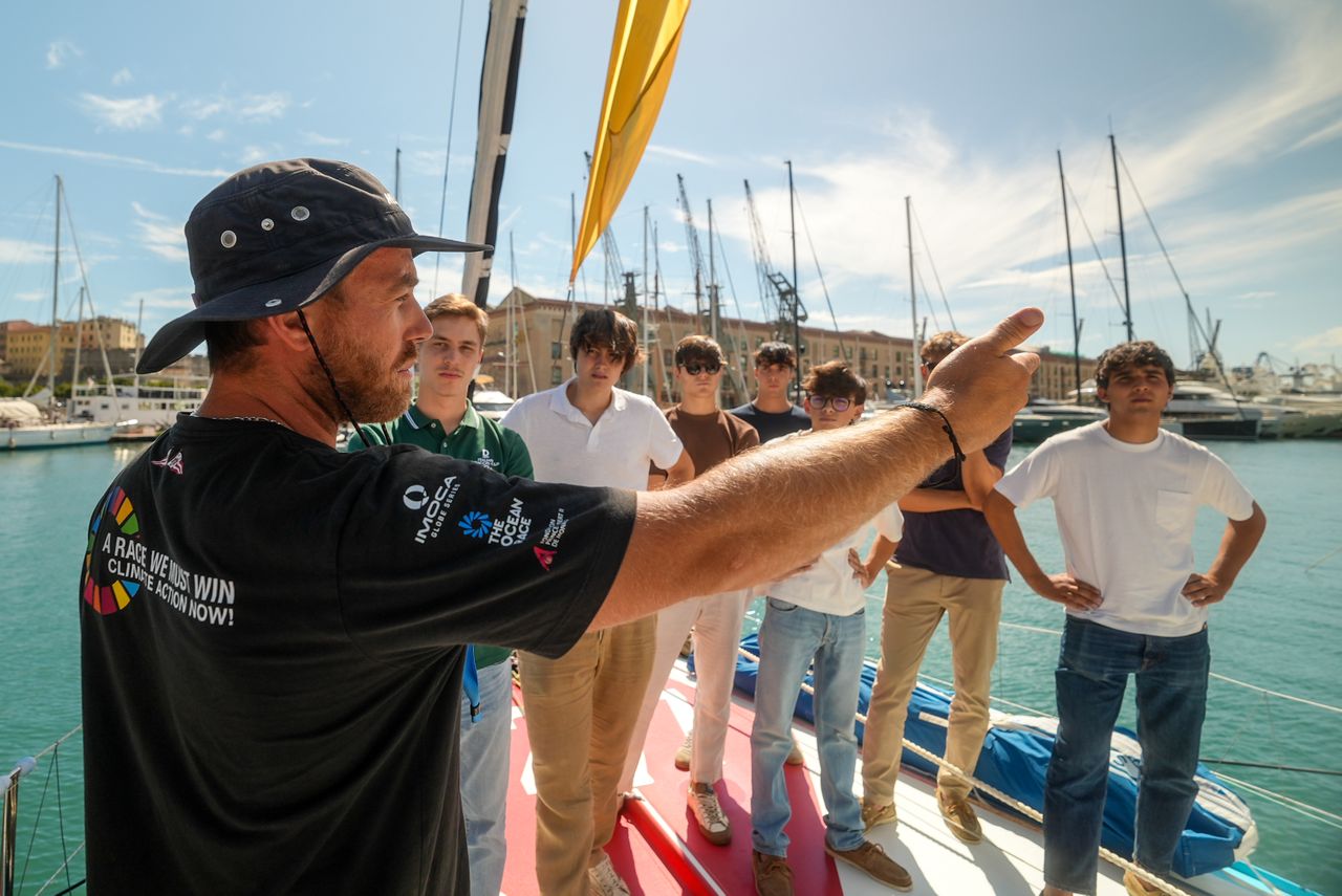 Students from the International School of Genova join for a tour of the Malizia - Seaexplorer racing yacht.
