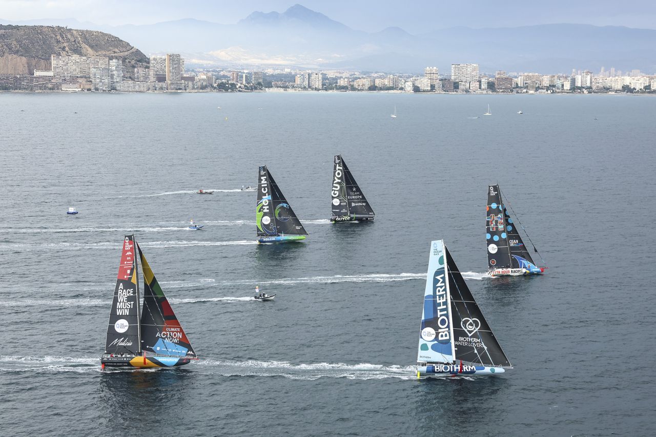 The fleet of five IMOCA boats racing against each other for the first time during the Alicante In-Port Race.