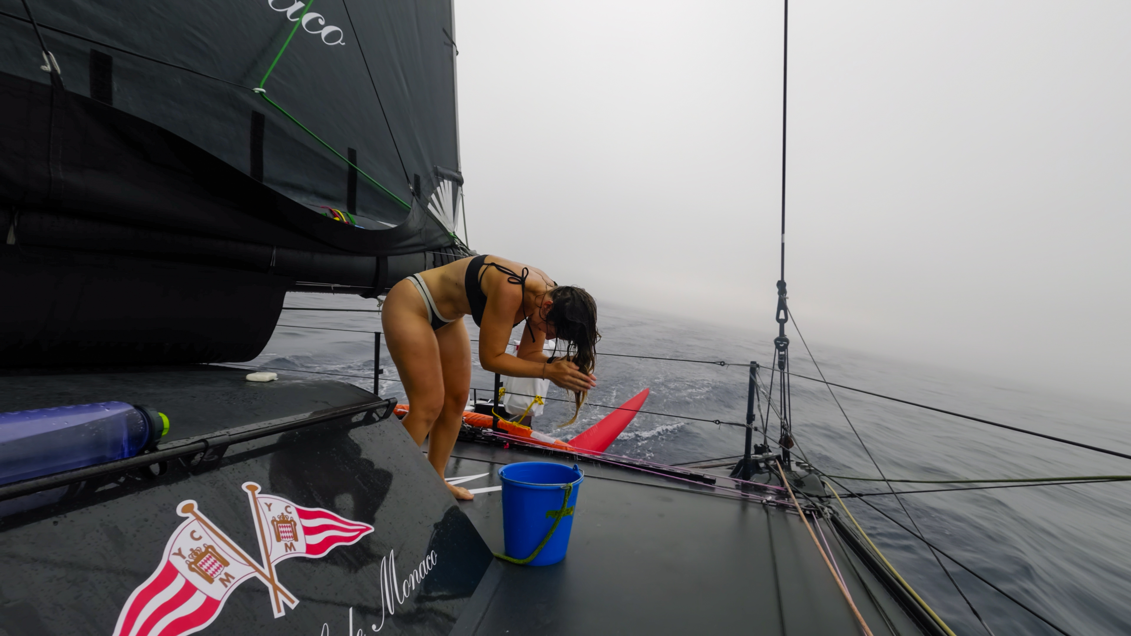 Alice showering onboard Malizia 4