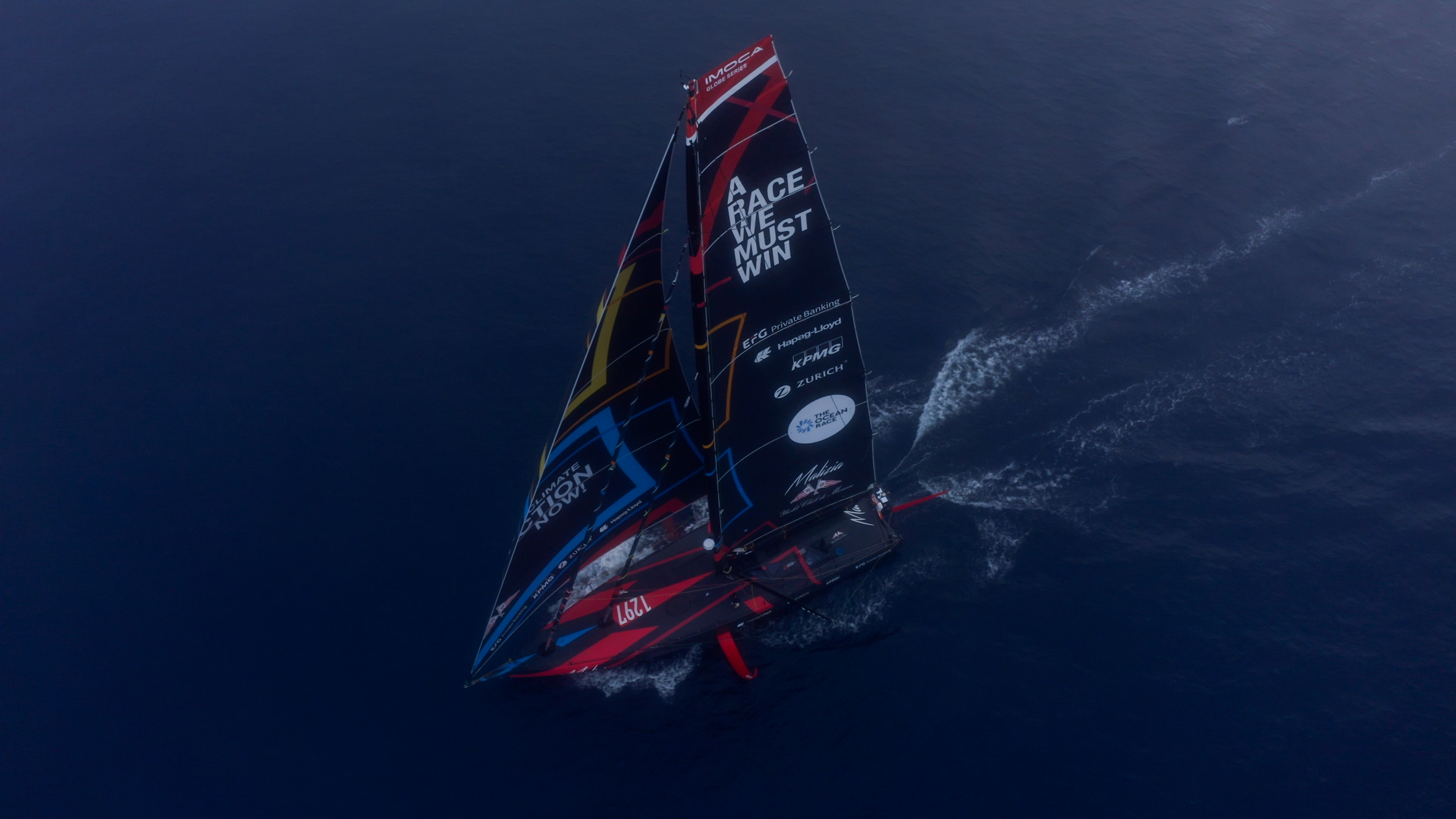 Malizia 4 sailing in the fog in the middle of the Atlantic Ocean