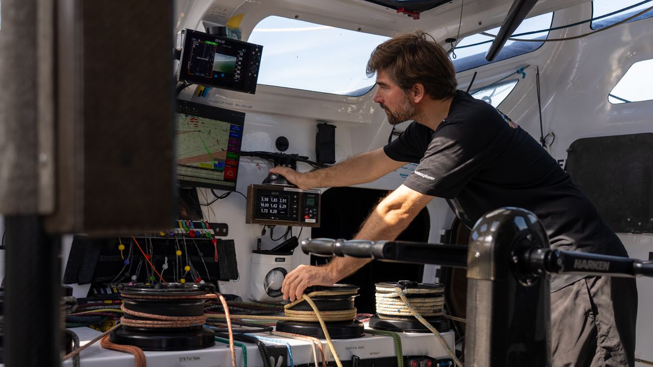 Boris Herrmann in the cockpit of his high-tech IMOCA racing yacht Malizia - Seaexplorer