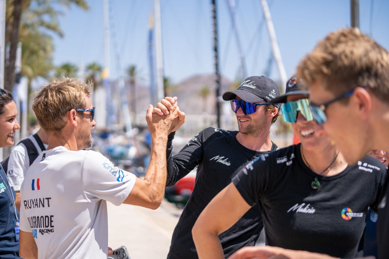 Allagrande MAPEI Racing's Thomas Ruyant congratulating Team Malizia's Loïs Berrerar after a neck and neck battle in Leg 2