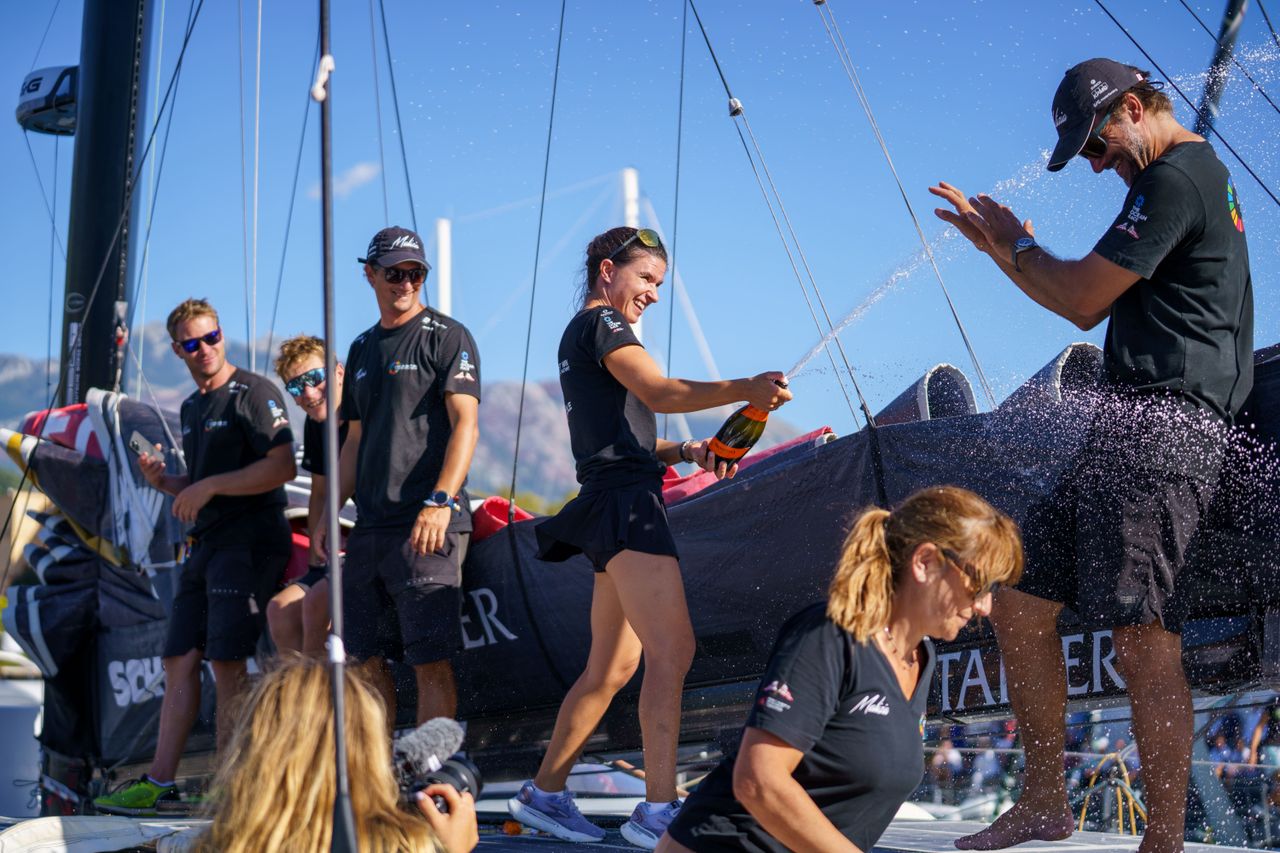 Team Malizia celebrating their fourth-place finish
