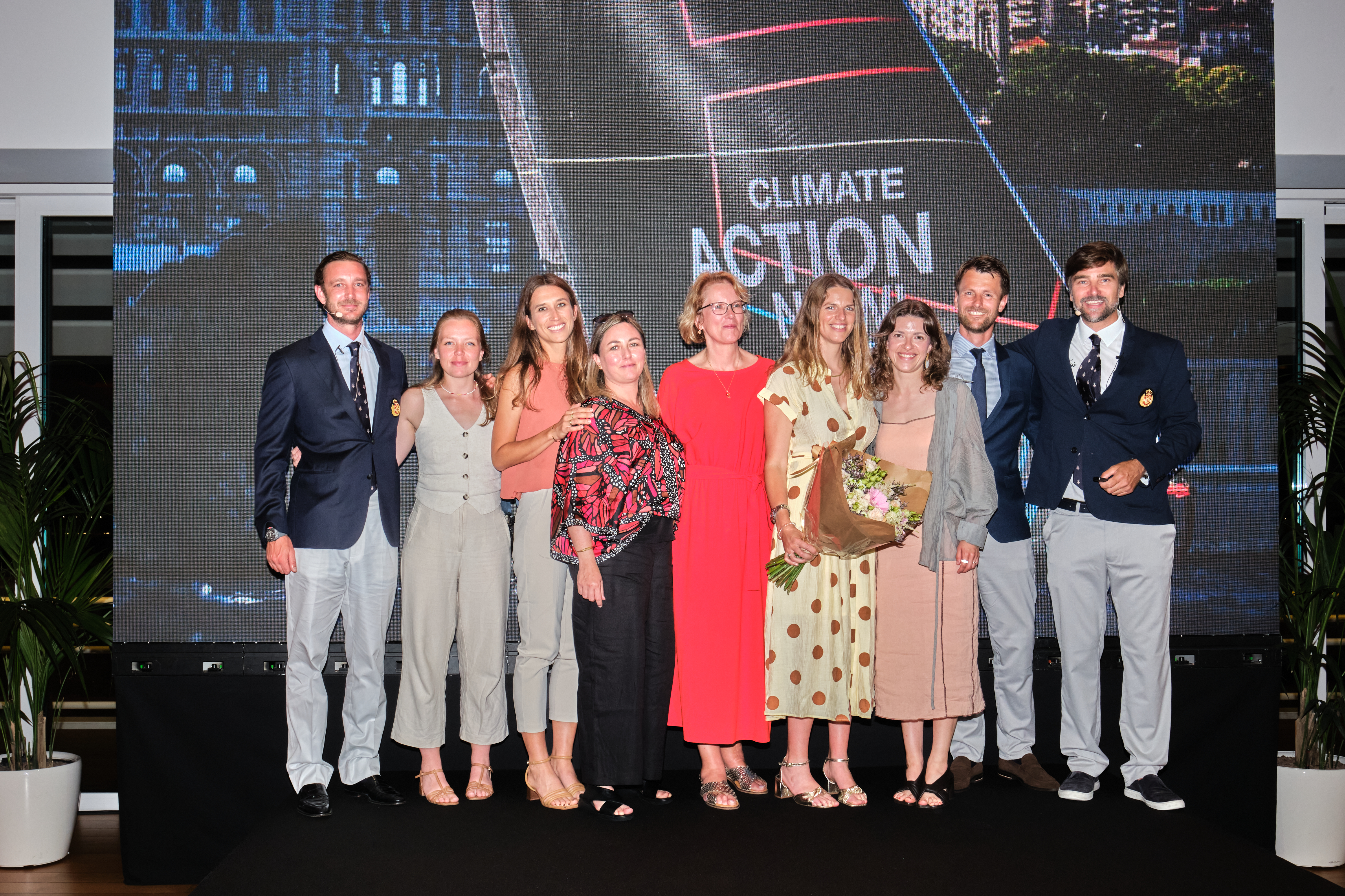 Pierre Casiraghi, Team Malizia co-founder and Vice-President of the Yacht Club de Monaco (left) with Team Malizia members present in Monaco and Boris Herrmann for the celebratory dinner-conference at the YCM