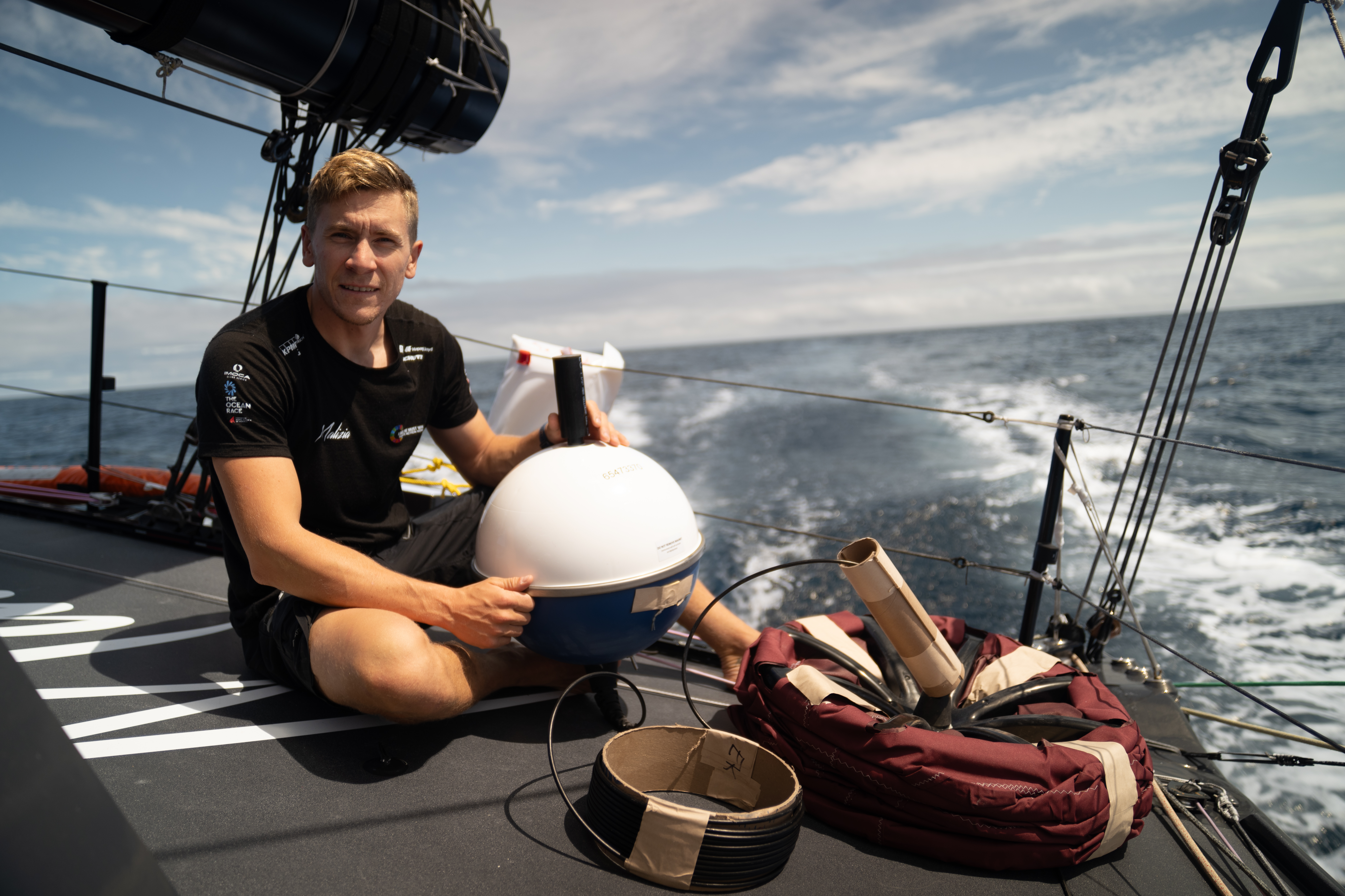 Will Harris moments before deploying the drifter buoy from onboard Malizia 4