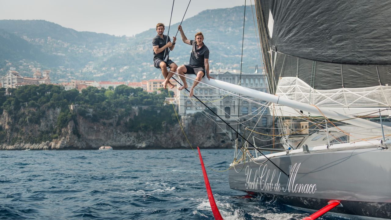 Team Malizia started as the dream of two friends, Boris Herrmann (left) and Pierre Casiraghi (right), here sitting on the outrigger of the team's first IMOCA,  Seaexplorer - Yacht Club de Monaco, in front of the Musée Océanographique de Monaco in 2017