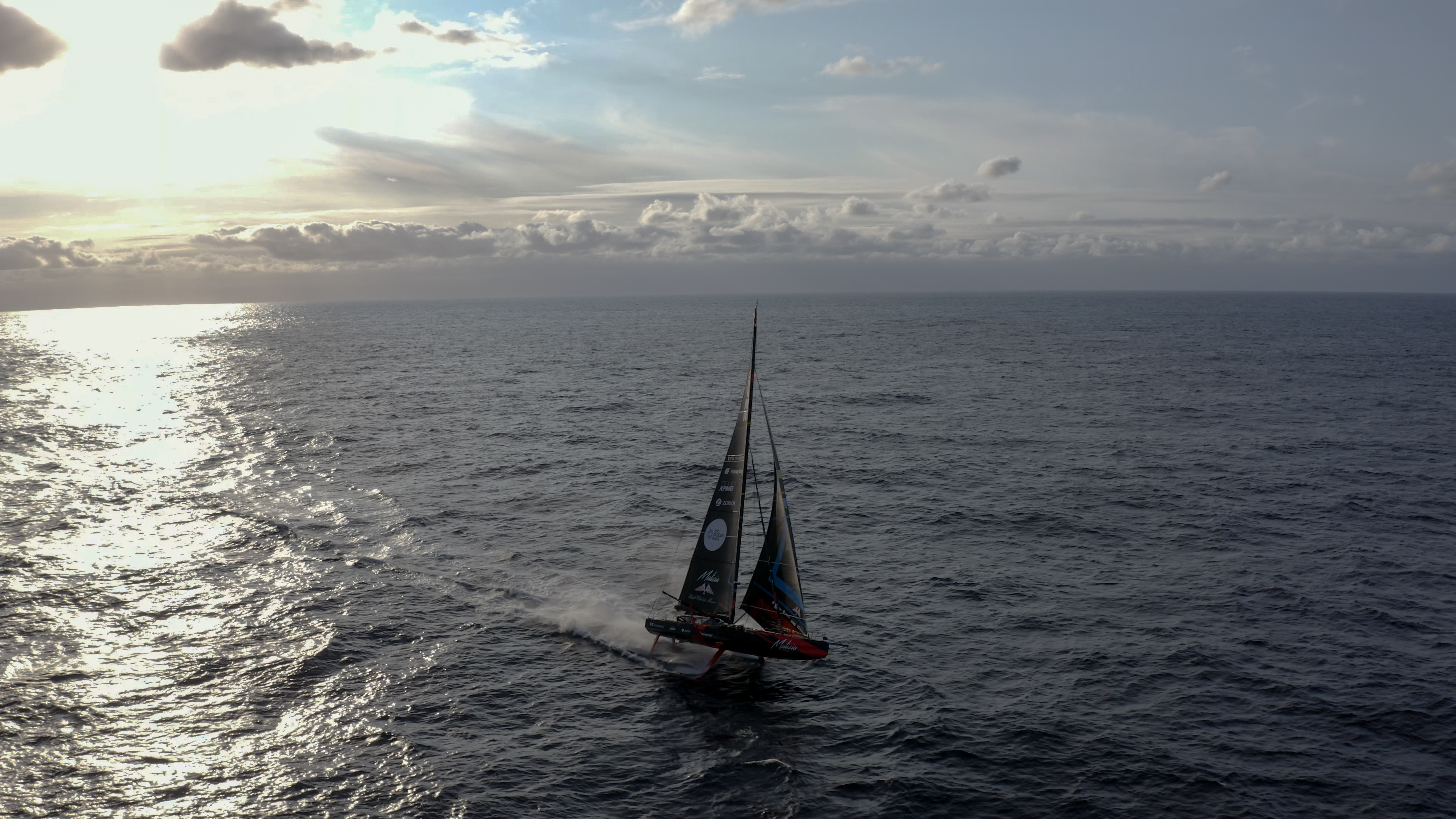 Malizia 4 flying across the Atlantic Ocean