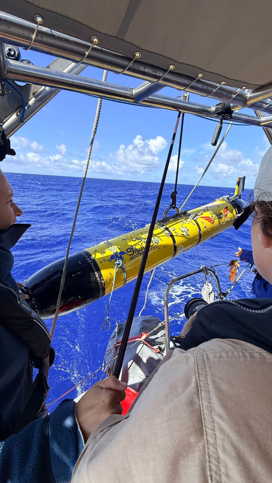 The Malizia Explorer crew recovering the device.
