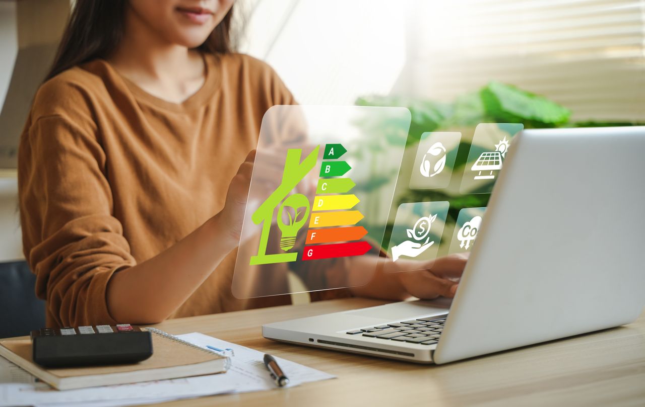 A woman sitting in front of her laptop