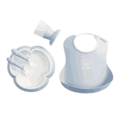 Light blue baby dining set including a bib, plate, cup, and two utensils with the babybjörn logotype