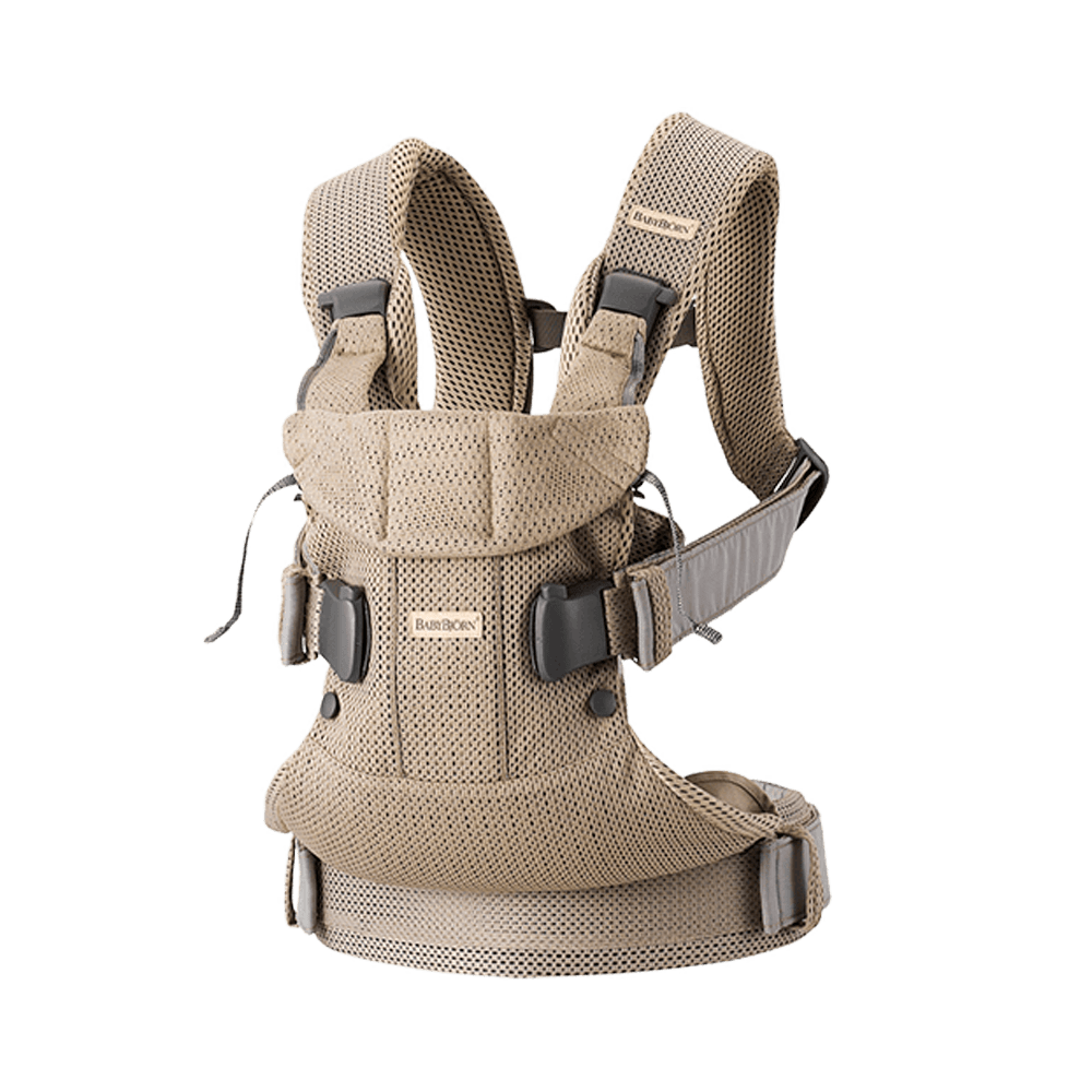 Beige baby carrier with adjustable straps and buckles, featuring a breathable mesh fabric for comfort and support.