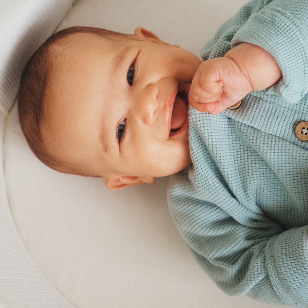 Baby in a baby crib by BabyBjörn