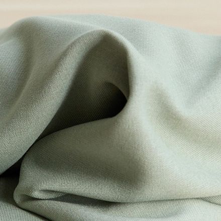 Soft brushed woven in light green from BabyBjörn