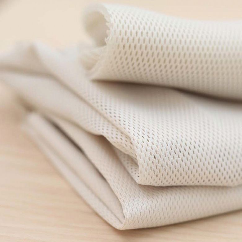 Airy mesh fabric in cream colour from BabyBjörn