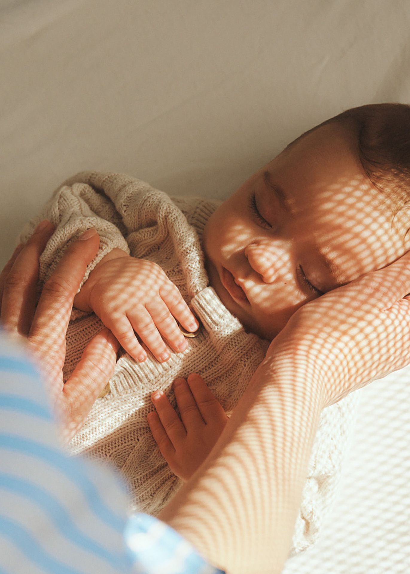 Child sleeping calmly and nice in a baby crib or cradle