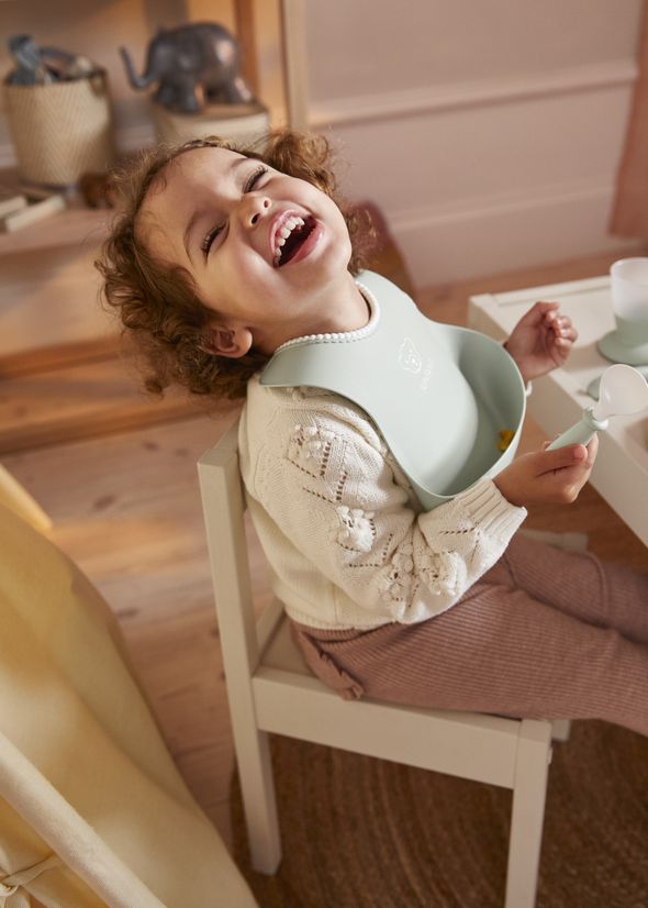 Baby Bib in powder green with big spill pocket in BPA-free plastic