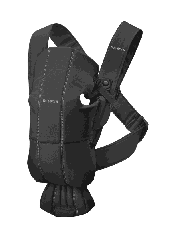 Black BabyBjörn baby carrier with adjustable straps and ergonomic design, featuring visible stitching and secure fastenings.
