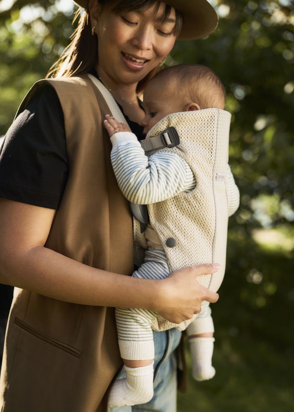 Baby Carrier Mini in cream 3D mesh - mum and baby out in a green park or garden