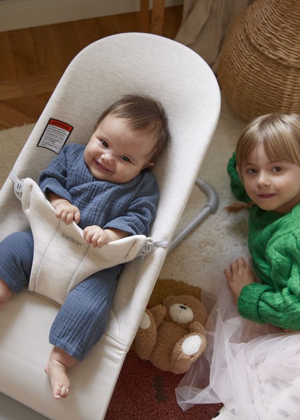 Bouncer Bliss baby bouncer in super‑soft jersey in a light beige color.