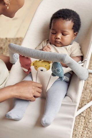 Soft and fun toy for baby bouncer BabyBjorn