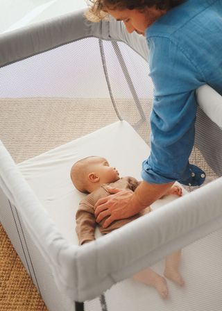 Baby sleeping hotsell in travel cot