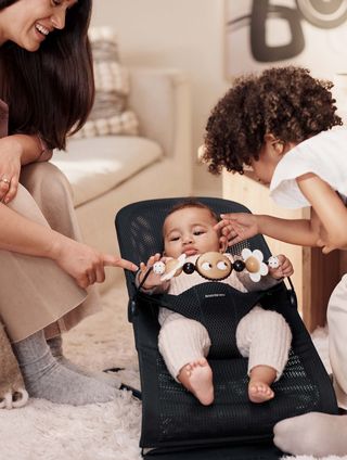 Black and white baby bouncer on sale