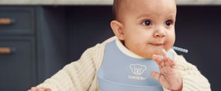 baby with small bib