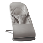 Gray baby bouncer with a soft fabric seat, harness, and minimalist metal frame, designed for comfort and safety.