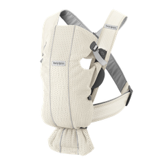 Beige cream ergonomic baby carrier with adjustable straps and breathable mesh fabric, designed for front carry.