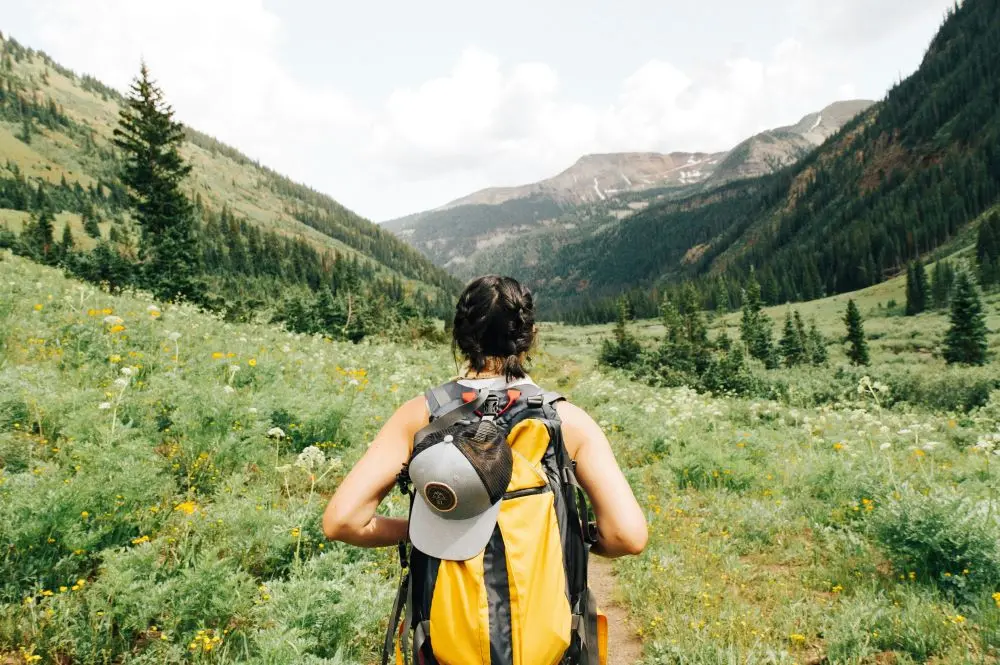 Woman Hiking On Mountains