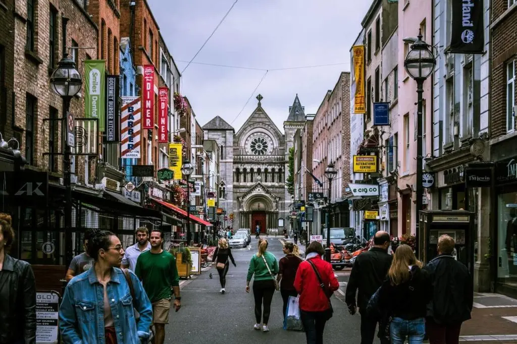 street in an english town with numerous store signs