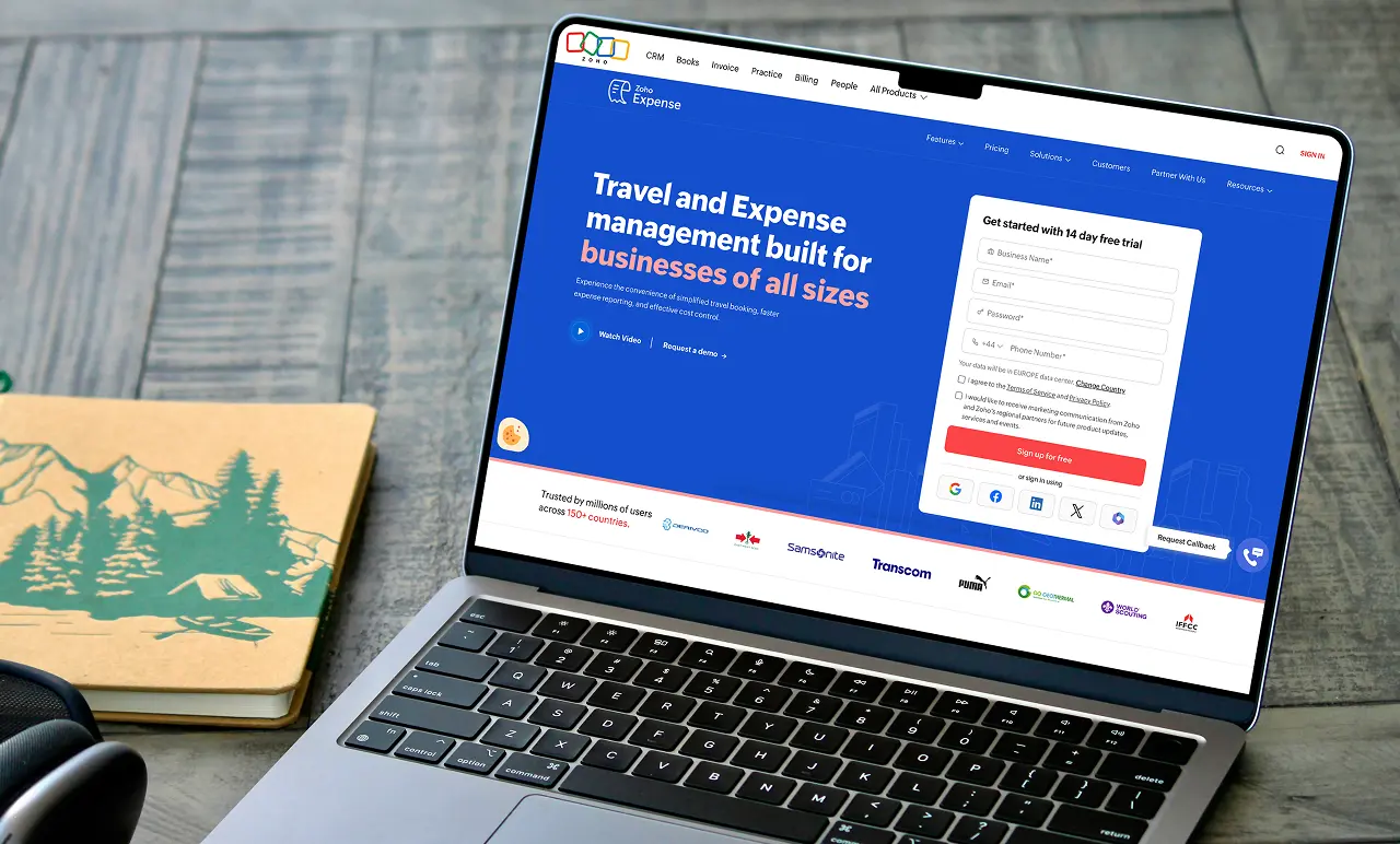 zoho expense homepage on an open laptop screen